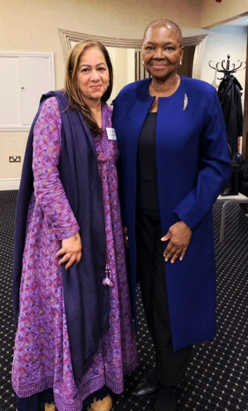 Madhuri and Baroness Amos stand together in colourful clothing