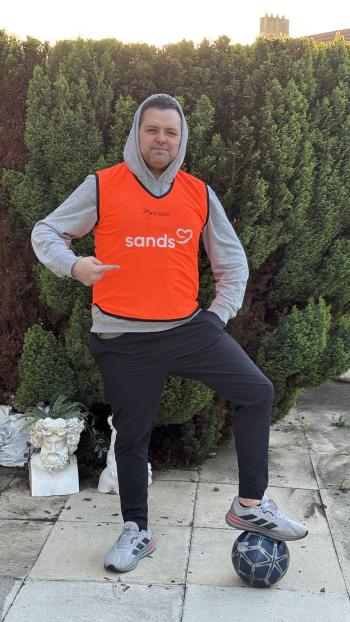 Andy in an orange Sands football vest