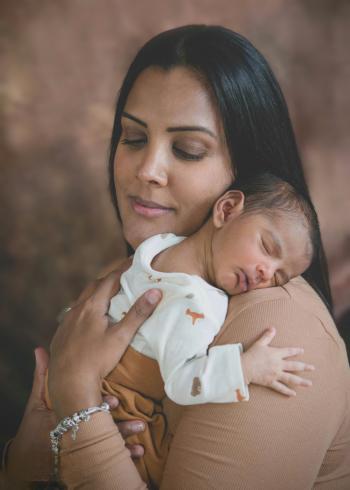 Bindu with her rainbow baby after experiencing baby loss multiple times