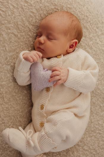 Baby issac with his brother Elias knitted heart who died as a result of neonatal loss from an undiagnosed heart condition.
