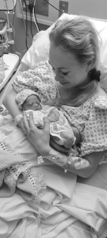 Jessica holding her son Jacob following his stillbirth.