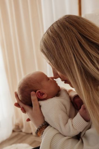 Jamie with her rainbow baby Issac after his big brother Elias was a neonatal loss.