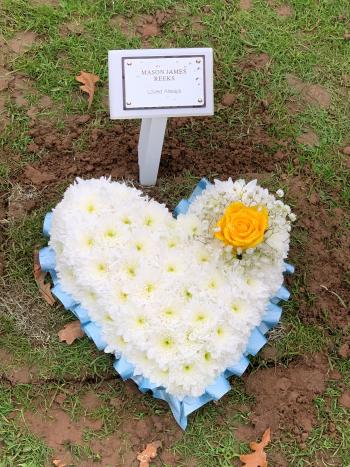 Mason’s flowers on his grave following his stillbirth.