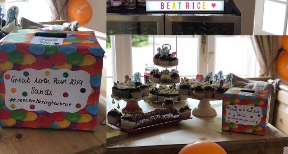 Tracey's cake sale table with cakes on and Beatrice's name on a sign