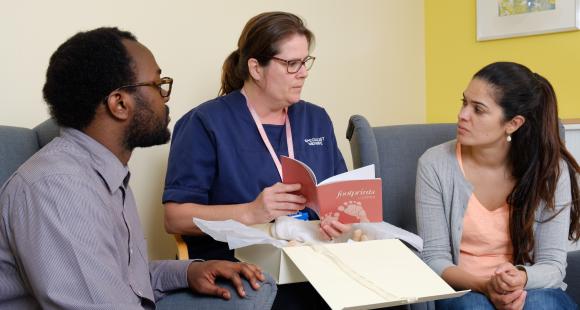 Midwife talking to parents