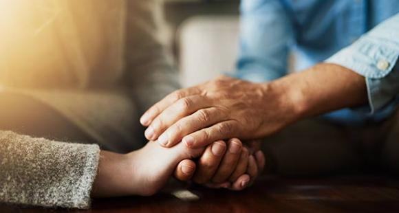FAQs about reviews - couple supportively holding hands