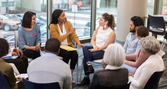 Researcher talking to a focus group