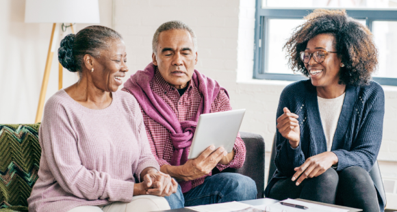 older couple writing a will with the help of a solicitor