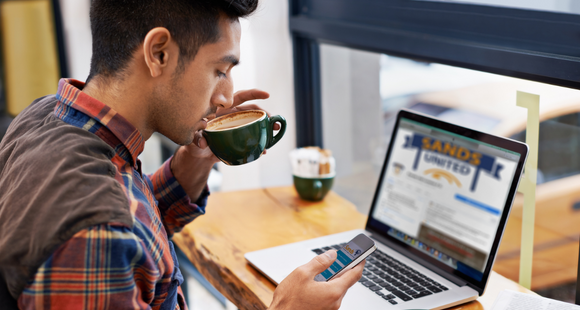 Man on phone and laptop 