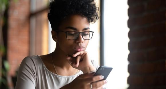 Lady scrolling through her phone looking for support