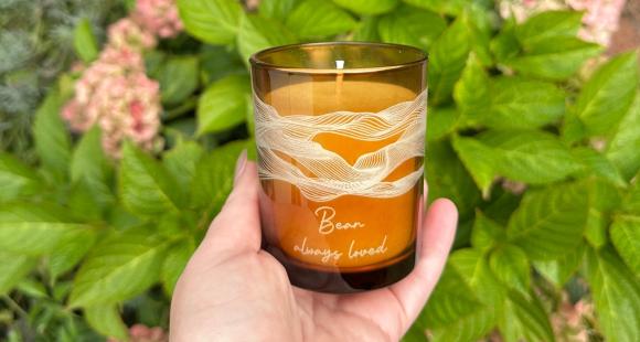 Image of a hand holding the personalised charity candle in aid of Sands
