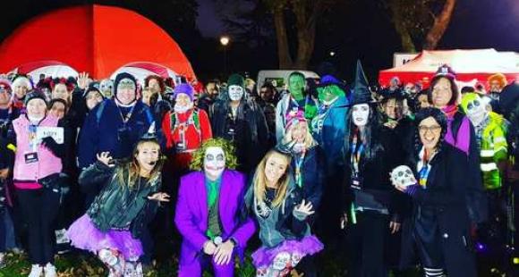 A group of people dressed up in costumes.