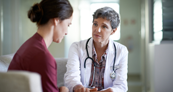 A doctor talking to a patient. 