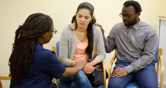 Bereaved parents talking to healthcare professional