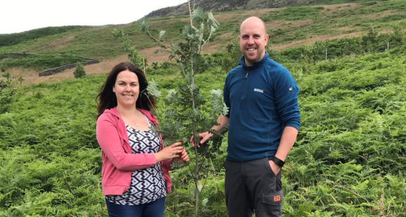 Louise and her partner planting a tree in memory of their daughter Rosie