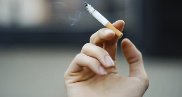 Hand holding cigarette