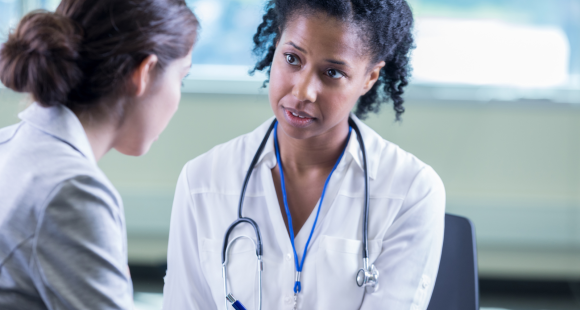 Two healthcare professionals talking