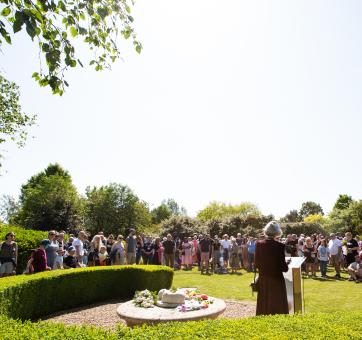 A large group of people gathered together in the Sands Garden