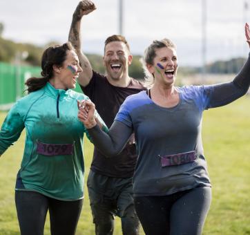 A small group of people after completing a physical activity for charity