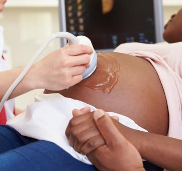 Black pregnant mother having an ultrasound scan