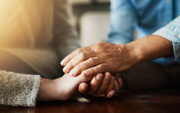 FAQs reviews - couple supportively holding hands