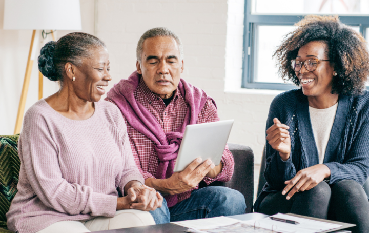 older couple writing a will with the help of a solicitor