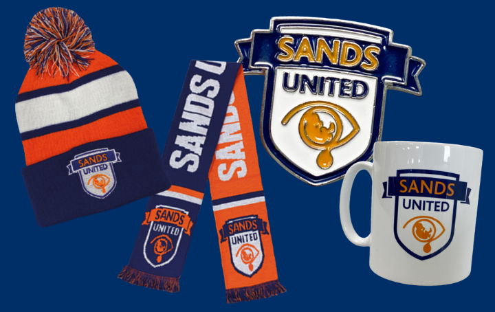 A Sands United hat, scarf, pin badge and mug.