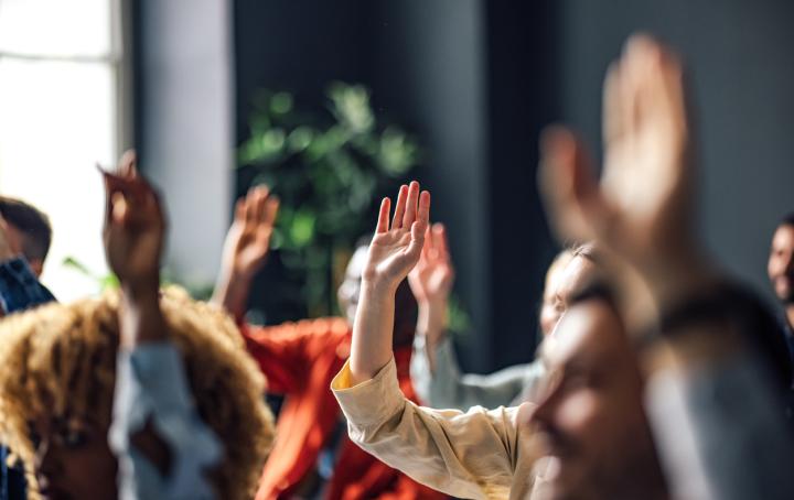 picture showing a selection of hands in the air