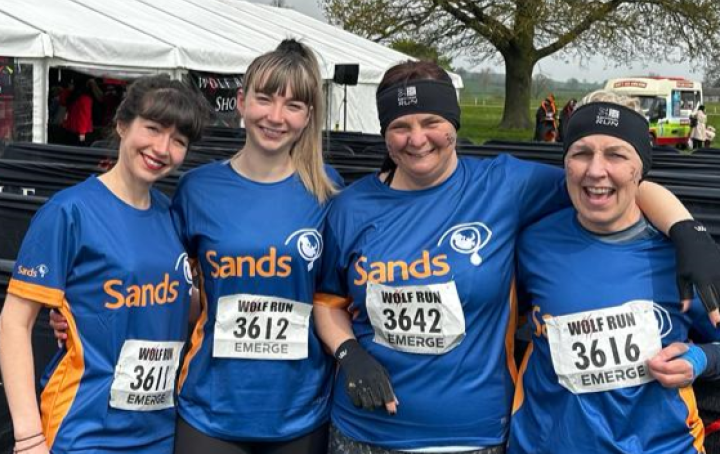 team of 4 ladies in sands tshirts 