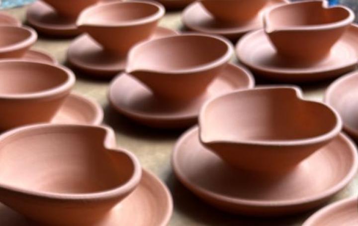 A selection of traditional and heart-shaped diyas