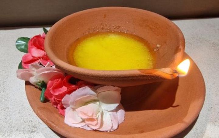Diya lit with wick and ghee