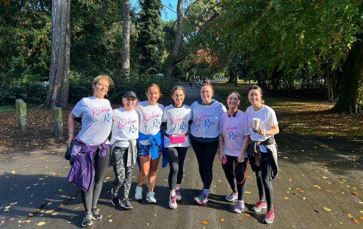 Group of women smiling and wearing Ribbon Run t-shirts 