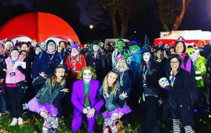 A group of people dressed up in costumes.