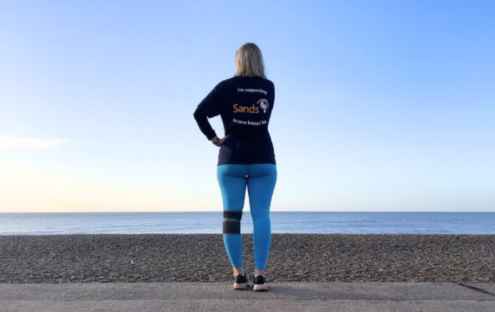 bereaved parent looking out over the horizon