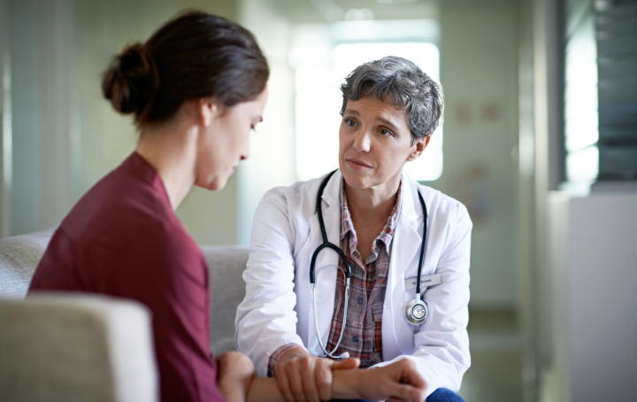A doctor talking to a patient. 