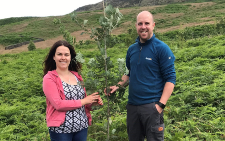 Louise and her partner planting a tree in memory of their daughter Rosie
