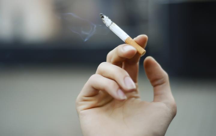 Hand holding cigarette