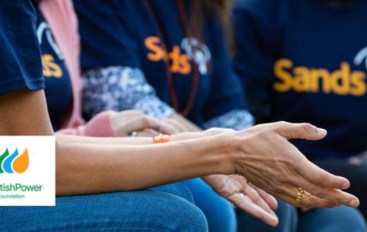 Ladies sat together with Sands t-shirts on