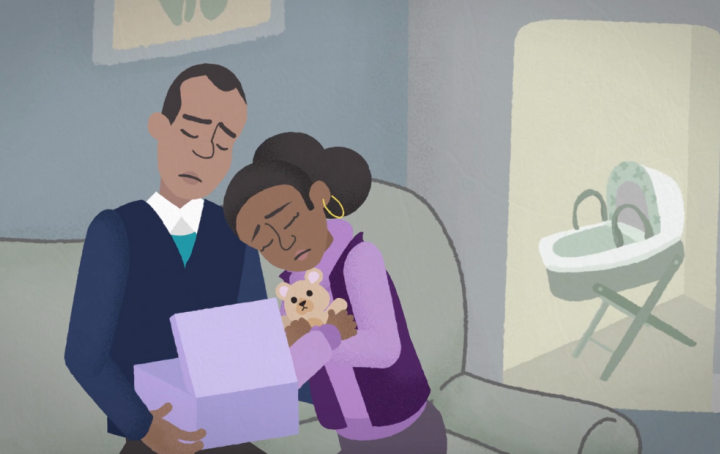 Still taken from Sands' growing around grief animation, showing a couple grieving for their baby, opening their memory box at home