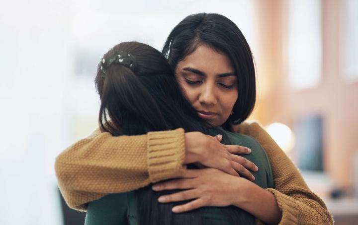 South Asian women hugging