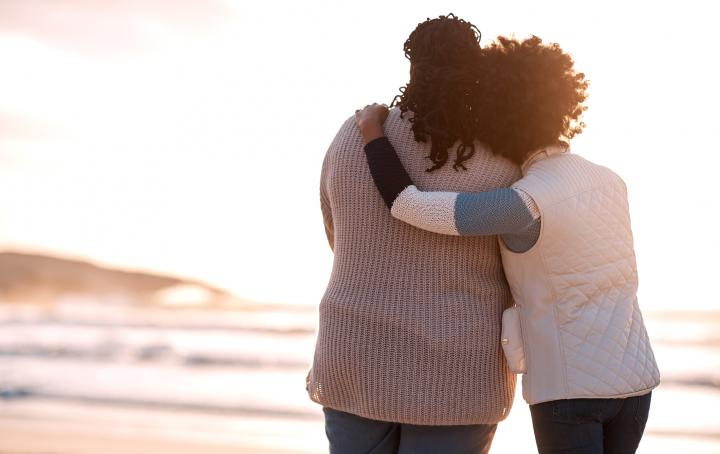 two black women hugging