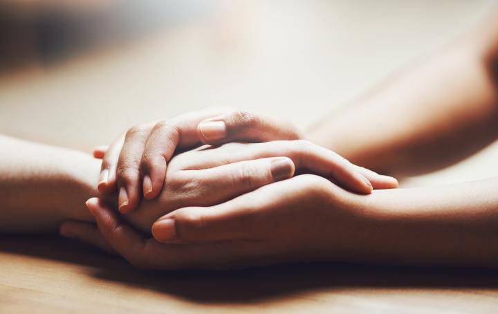 two people holding hands
