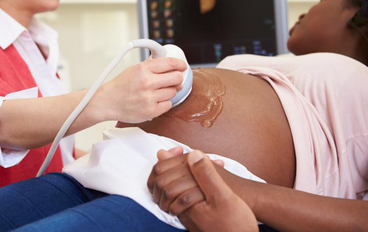 woman having pregnancy scan
